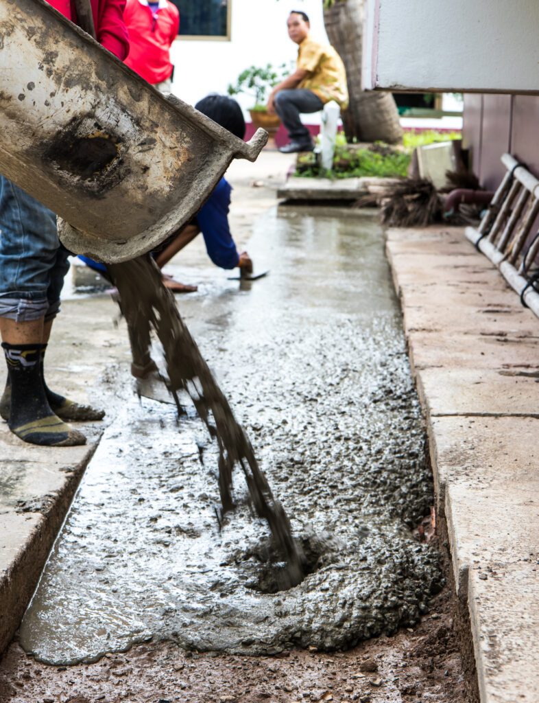 Workers pour concrete control.